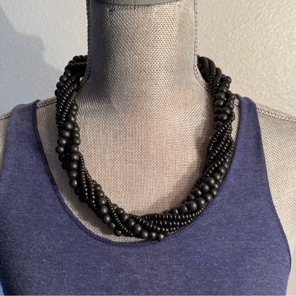 Vintage black wood and plastic bead multistrand necklace in excellent condition!